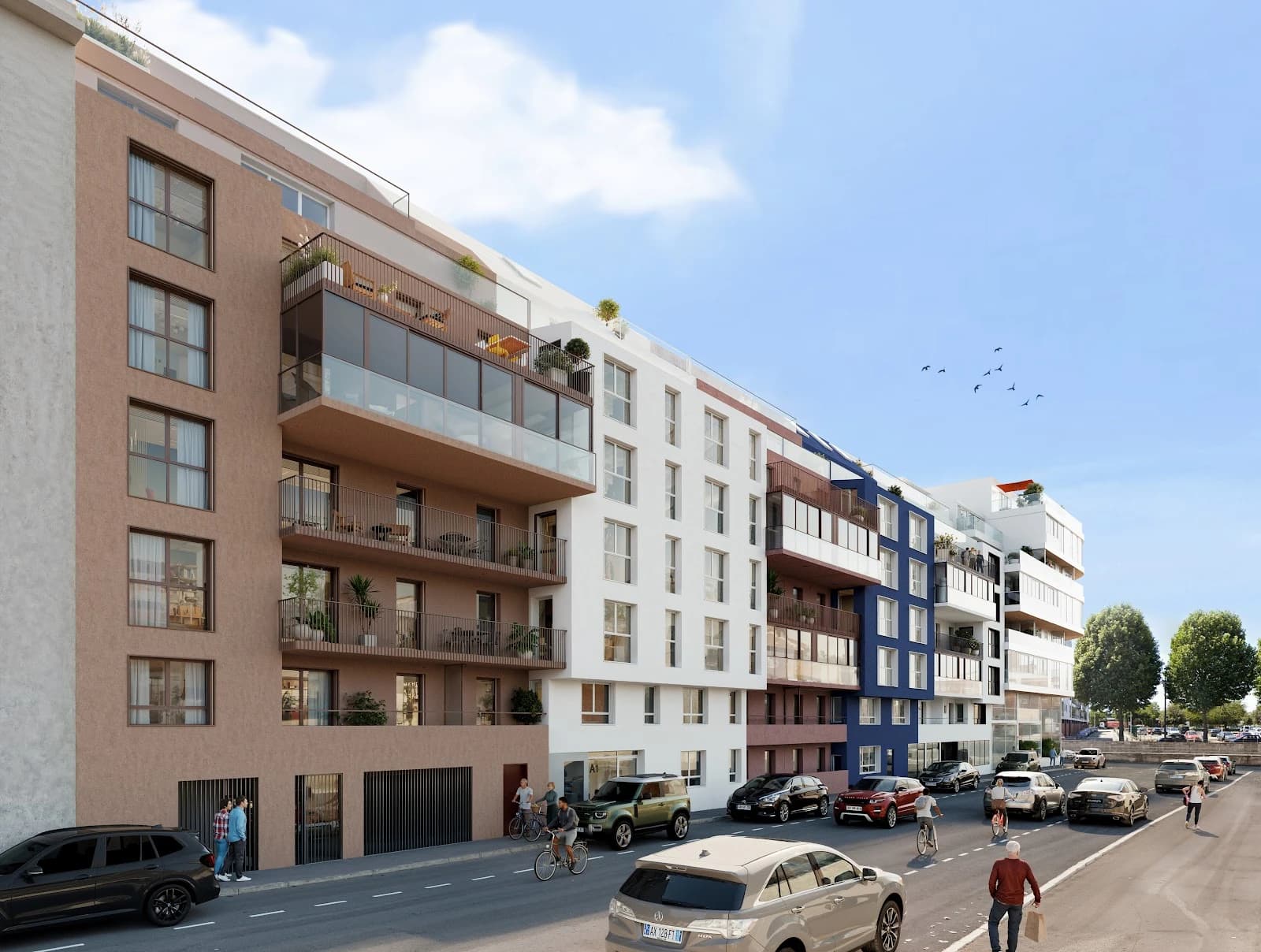 Perspective de Côté Pasteur vue depuis la rue : enfilade de façades rose, blanche et bleue, balcons et loggias, commerces en rez-de-chaussée et piste cyclable au premier plan