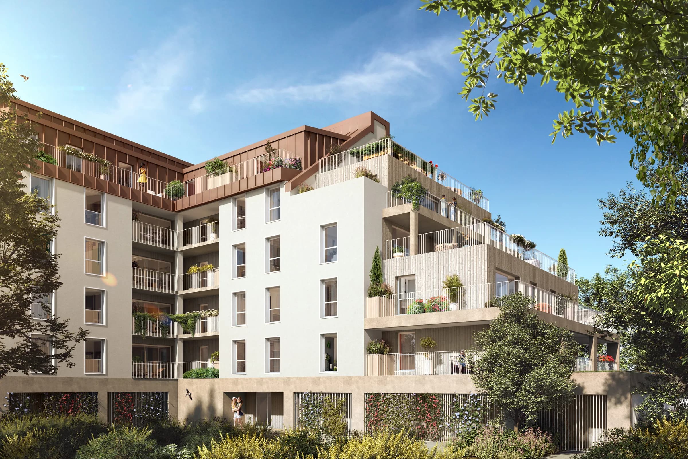 L’angle du bâtiment côté cour : balcons et terrasses en gradins largement plantés, attique en zinc cuivré, végétation grimpante sur le soubassement